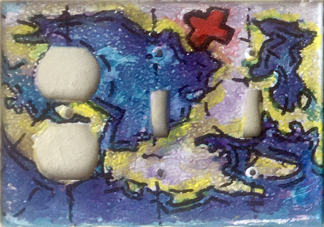 A double switchplate/outlet cover